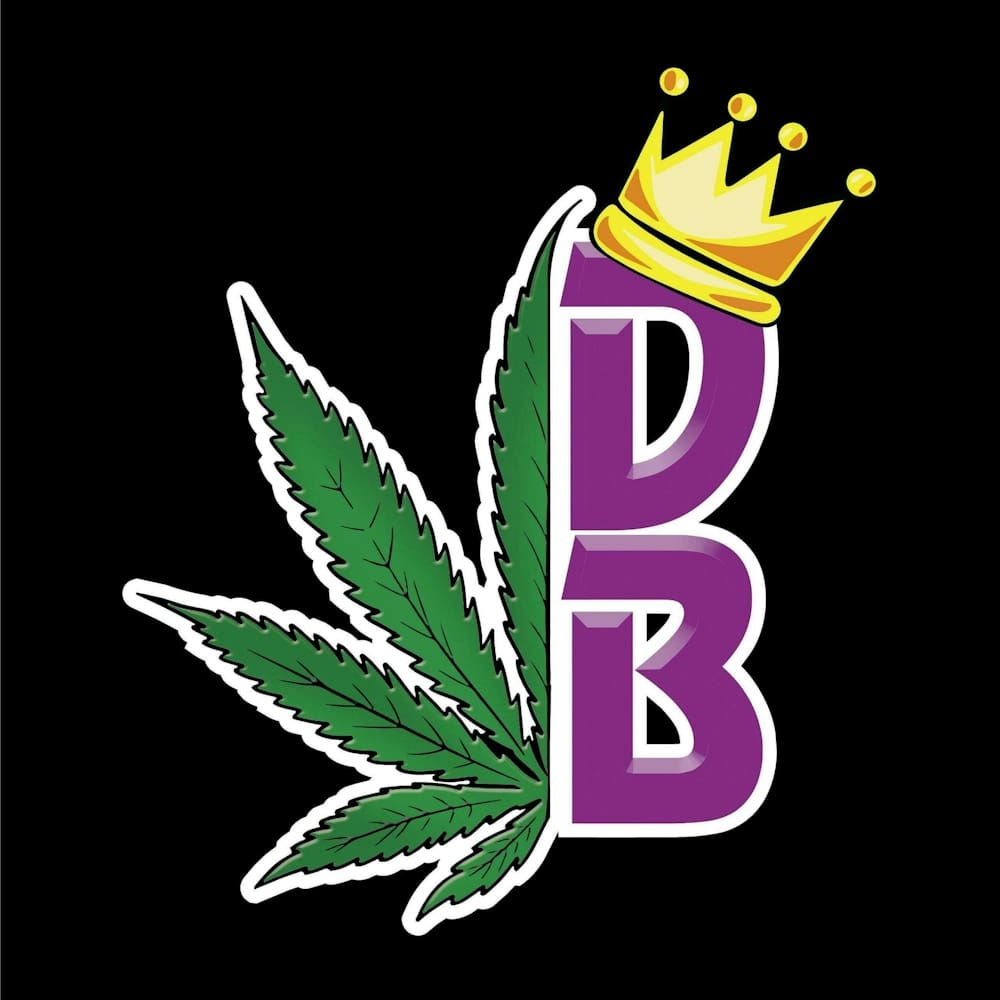 A purple letter with a crown and marijuana leaf.